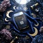 Midnight Celestial RSVP with QR reply code on a phone screen on navy velvet, with dried hydrangea and a brass telescope