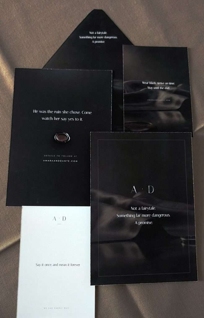 Obsidian Vow card backs laid together, including the save the date back with a wax seal, the envelope liner, the wedding invitation back, and a thank you card.