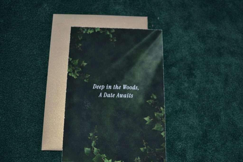 Enchanted Forest save the date card with its envelope