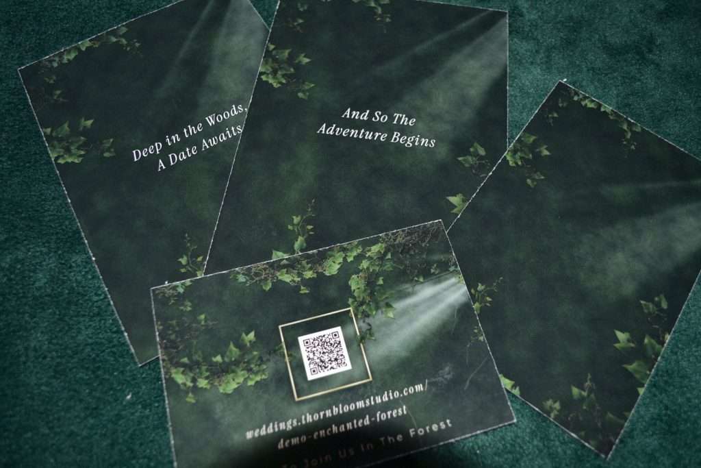 Backs of printed Enchanted Forest stationery pieces with a legible QR code
