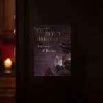 Dark Romance 5x7 save the date magnet on a dark fridge door by candlelight
