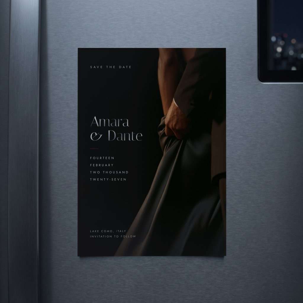 Obsidian Vow 5x7 save the date magnet in Silver on a brushed steel fridge door