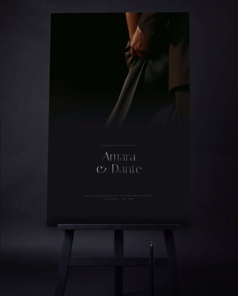 The Obsidian Vow welcome sign in Silver at 24 by 36 on a black easel, the couple names set beneath the photograph. Print mockup.